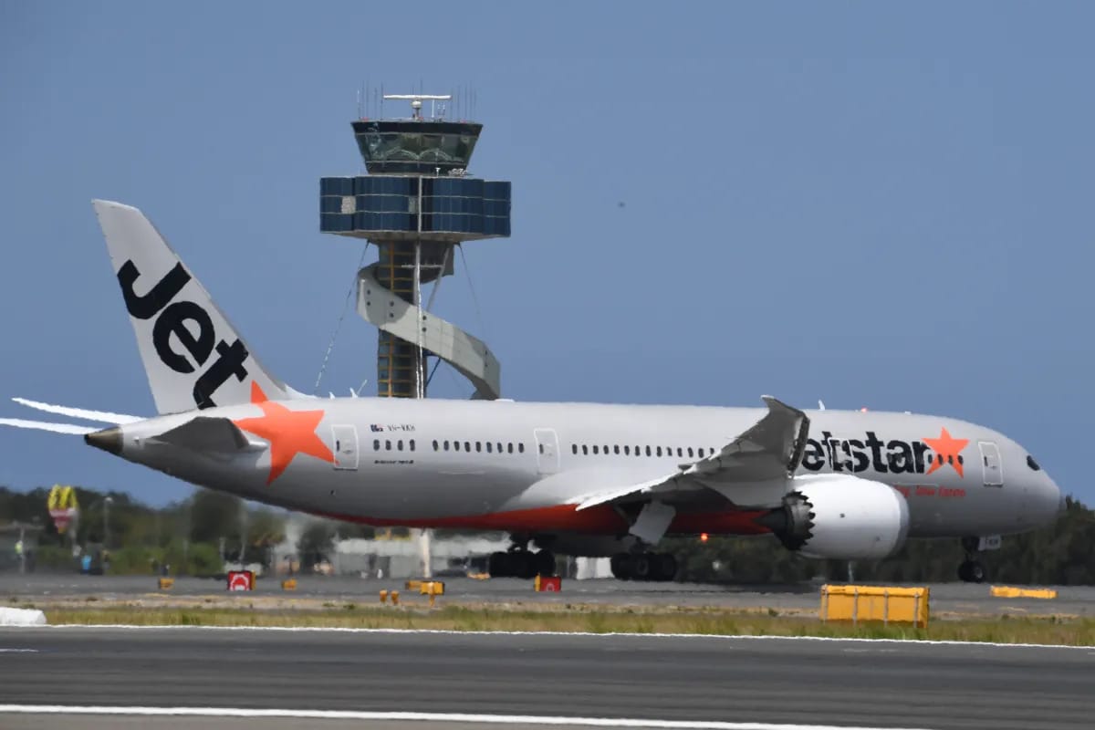 Passenger aboard plane arrested for breaking through the evacuation door and getting onto the wing