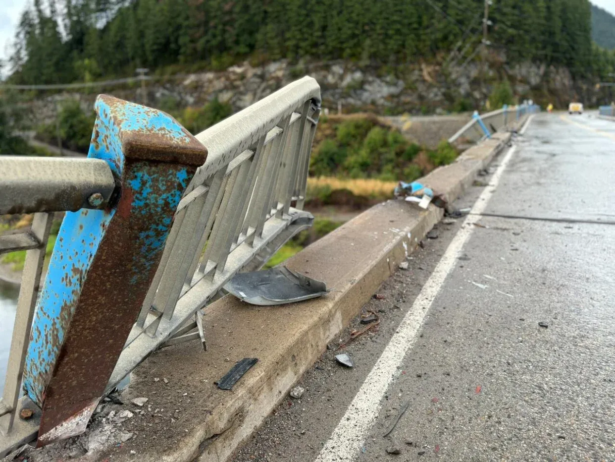 Driver dies after semi-truck crashes through bridge, plunges into B.C. lake