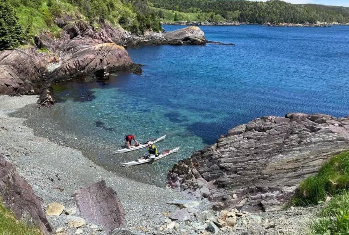 In an attempt to break the record, two kayakers circumnavigate Newfoundland in 49 days at the whim of the sea