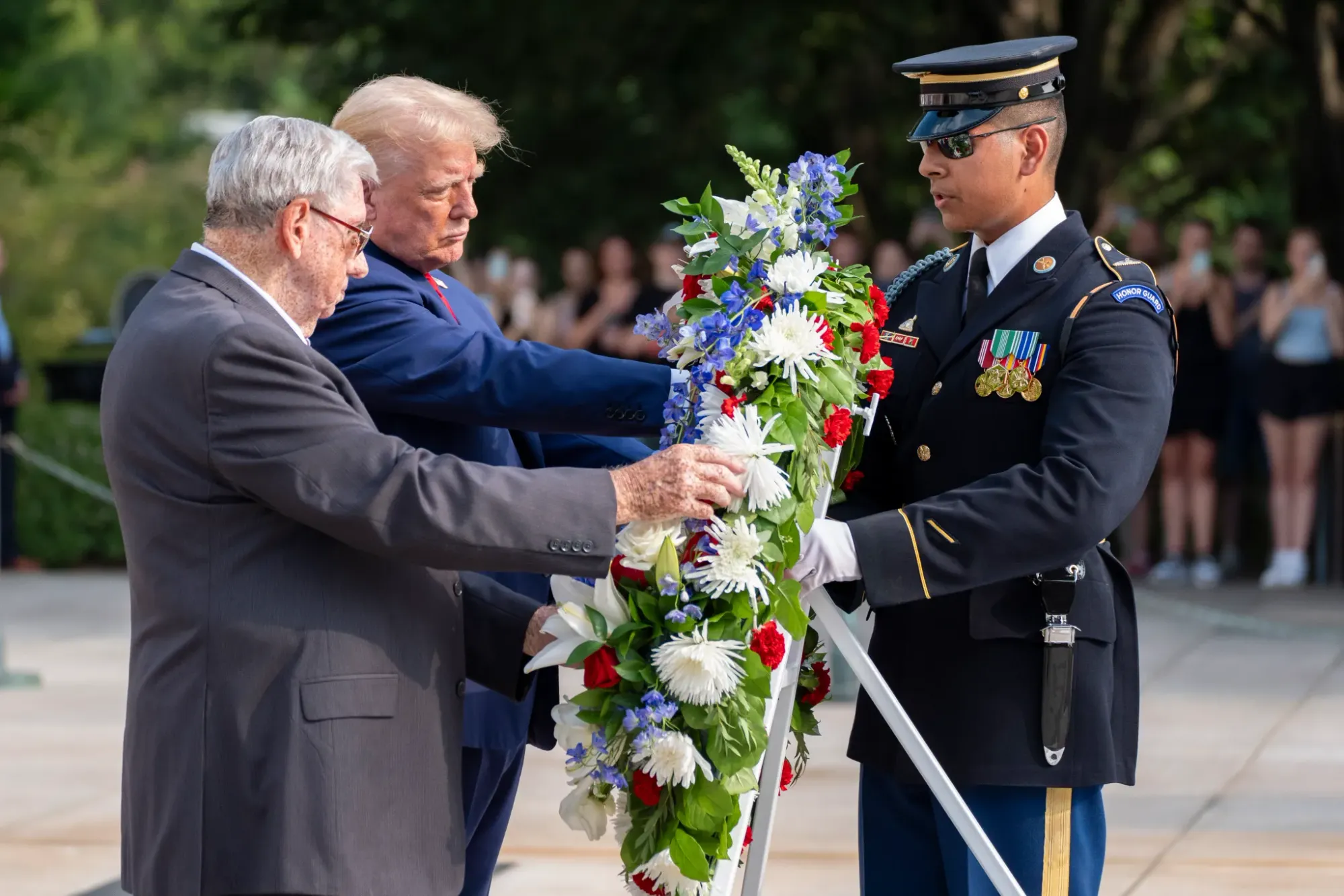 Trump staff warned about taking photos before cemetery altercation: official