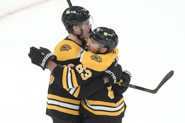 Marchand scores OT goal to lead Bruins to 4-3 victory over Flames