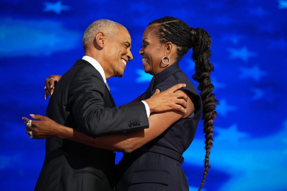 Barack and Michelle Obama electrify Democrats but warn of tight race post image